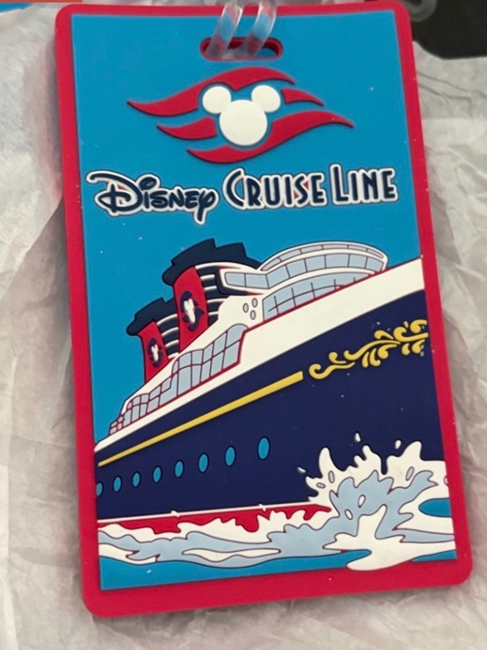 Disney Cruise Line luggage tags in blue, red and gold with cruise line graphic